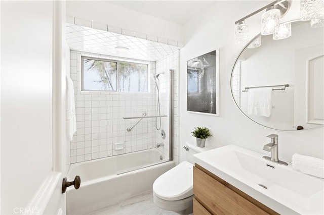 full bathroom featuring vanity, toilet, and tiled shower / bath