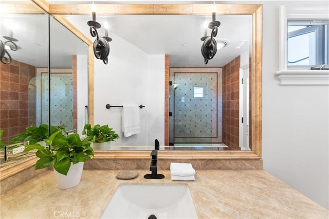 bathroom featuring vanity and an enclosed shower