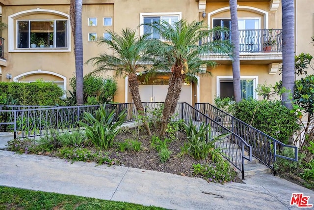 doorway to property featuring a balcony