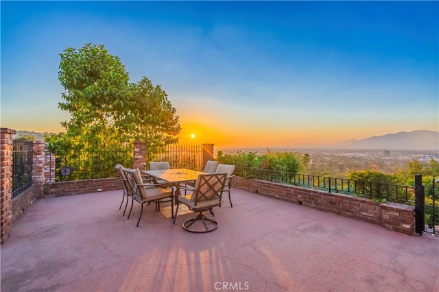 patio terrace at dusk with a mountain view