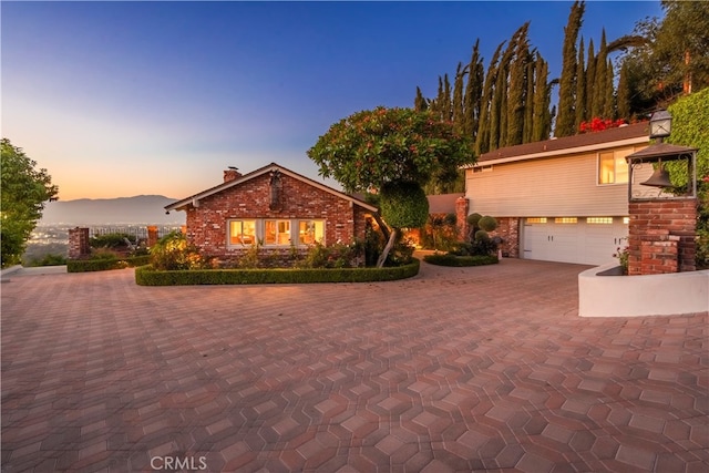 view of front of house featuring a mountain view and a garage