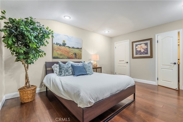 bedroom with hardwood / wood-style flooring