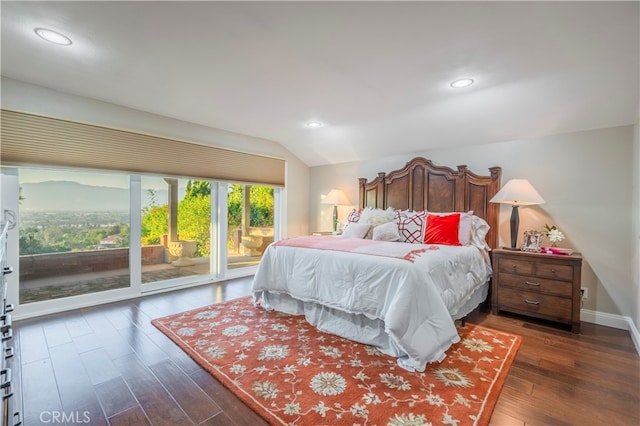 bedroom with lofted ceiling, dark hardwood / wood-style floors, and access to outside