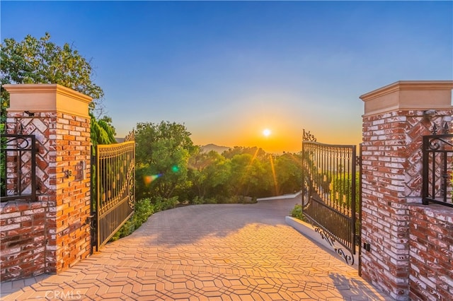 view of gate at dusk