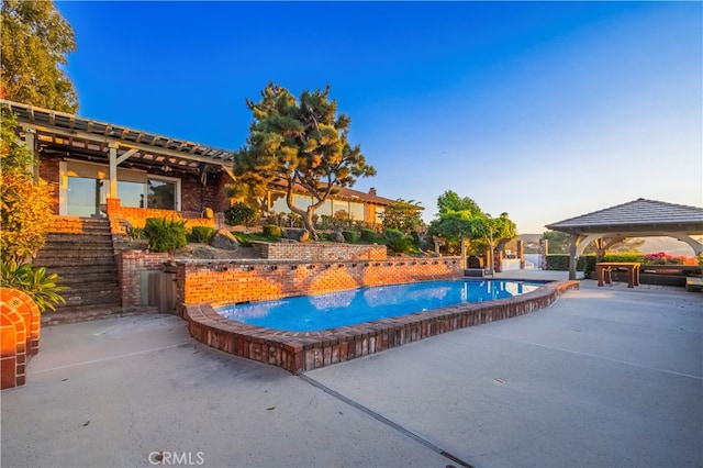 view of pool featuring a gazebo and a patio