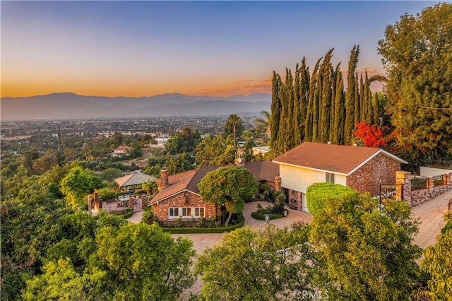 aerial view at dusk with a mountain view