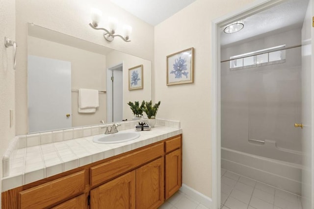 bathroom featuring vanity, washtub / shower combination, and tile patterned floors