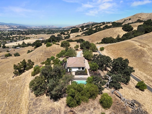 birds eye view of property with a mountain view