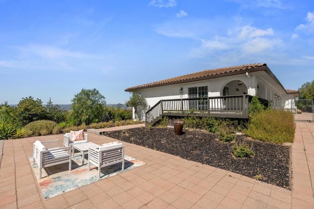 rear view of house with a patio