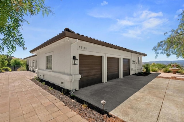 view of property exterior with a garage