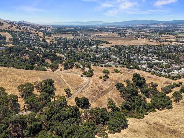 birds eye view of property with a mountain view