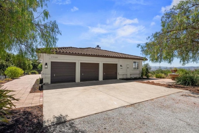 view of side of property featuring a garage