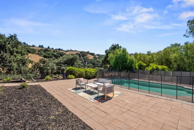 view of patio featuring a fenced in pool