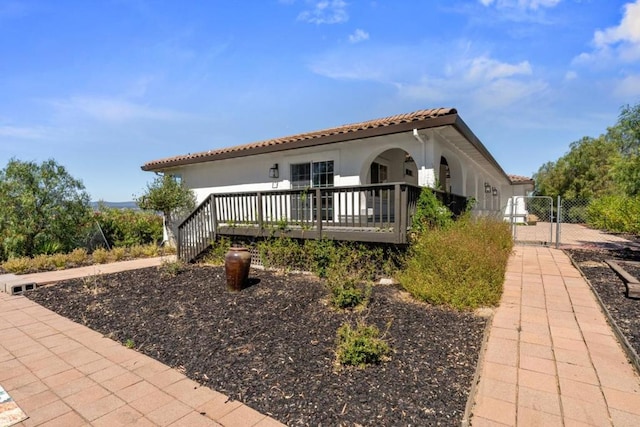 exterior space featuring a wooden deck