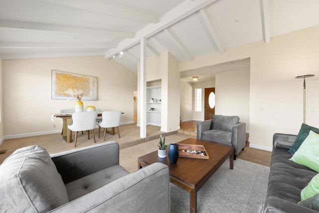 living room featuring carpet floors and lofted ceiling with beams