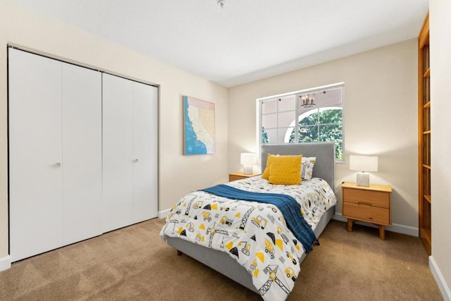 carpeted bedroom with a closet