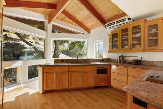 kitchen with sink, light hardwood / wood-style flooring, lofted ceiling with beams, dark stone counters, and black electric stovetop