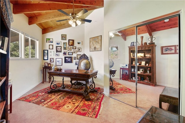 home office with lofted ceiling with beams, light colored carpet, ceiling fan, and wood ceiling