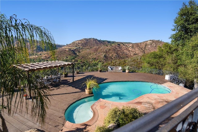 view of swimming pool featuring a mountain view and a patio area