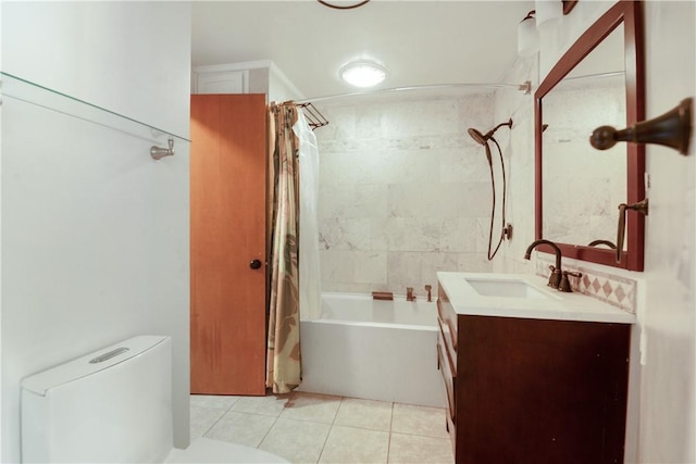 full bathroom featuring tile patterned flooring, vanity, toilet, and shower / bathtub combination with curtain