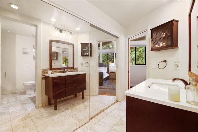 bathroom with vanity and toilet