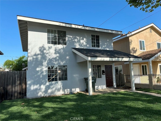 back of house with a yard