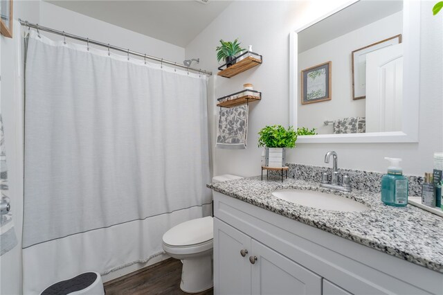 34334 Swordfern Pl, Murrieta, CA 92563 - full bathroom with vanity, shower / bathtub combination with curtain, toilet, and hardwood / wood-style flooring
