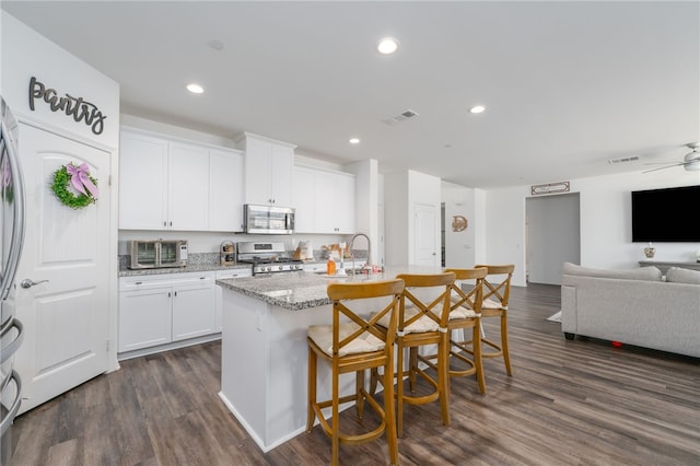 34334 Swordfern Pl, Murrieta, CA 92563 - kitchen featuring white cabinets, stainless steel appliances, dark hardwood / wood-style flooring, and ceiling fan