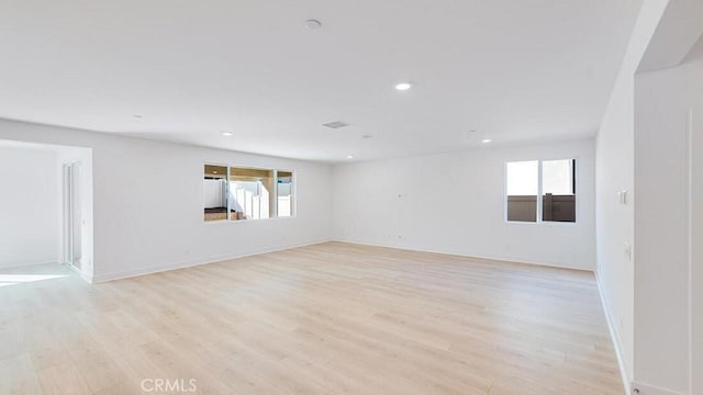 spare room with light wood-type flooring