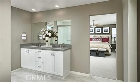 bathroom featuring ceiling fan and vanity