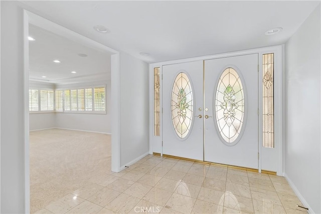 foyer entrance featuring french doors