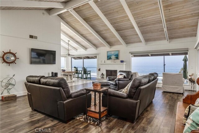 living room featuring ceiling fan, beam ceiling, dark wood-type flooring, and high vaulted ceiling