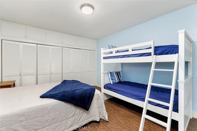 bedroom with hardwood / wood-style flooring and a closet