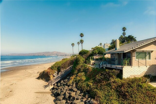 property view of water featuring a beach view