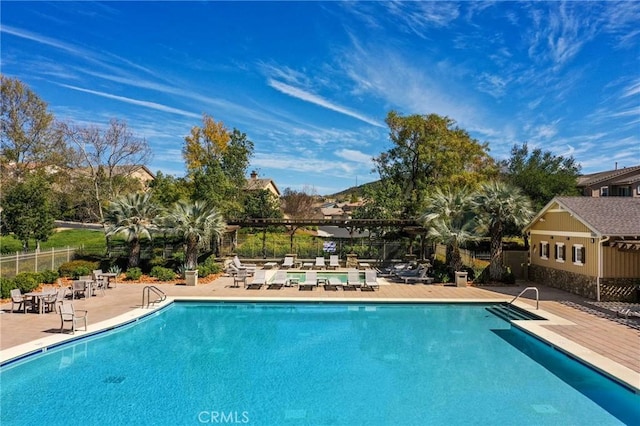 view of swimming pool featuring a patio area