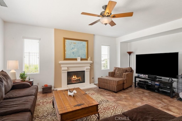 living room with a healthy amount of sunlight and ceiling fan