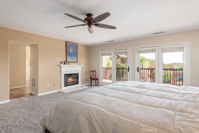 carpeted bedroom featuring ceiling fan and access to outside