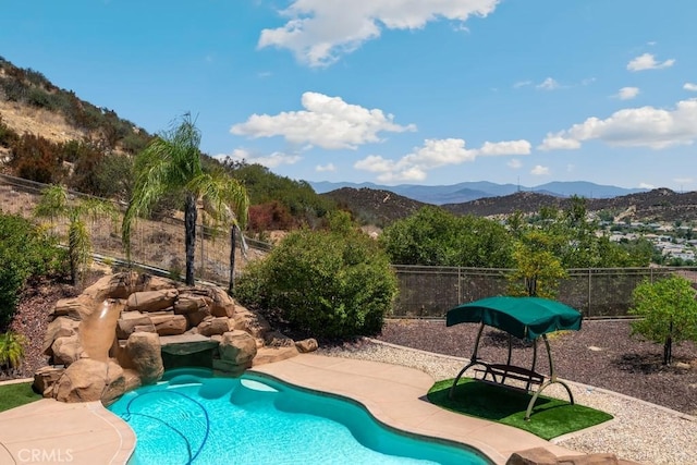 view of pool with a mountain view