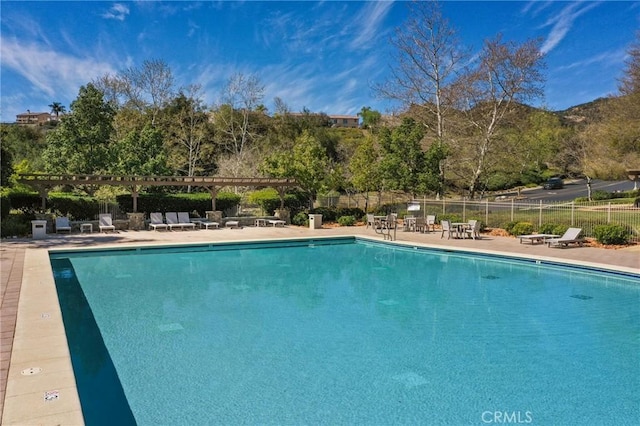 view of pool featuring a pergola and a patio