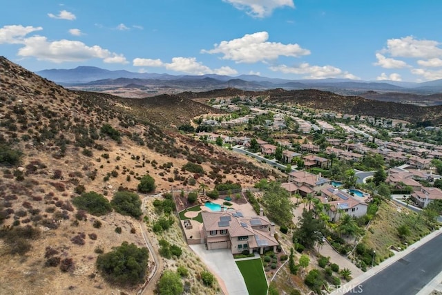 birds eye view of property with a mountain view