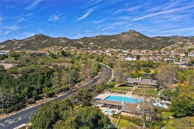 birds eye view of property with a mountain view