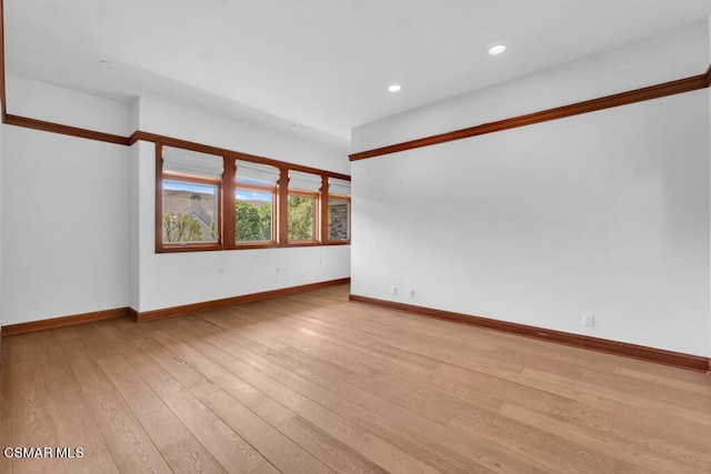 unfurnished room with light hardwood / wood-style floors