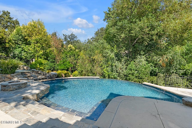 view of swimming pool featuring a patio area