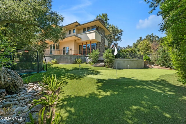 view of yard with a balcony