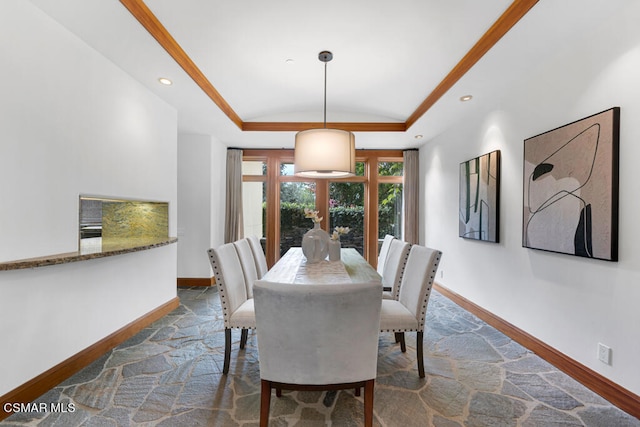 dining space featuring a tray ceiling