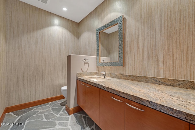 bathroom with vanity and toilet