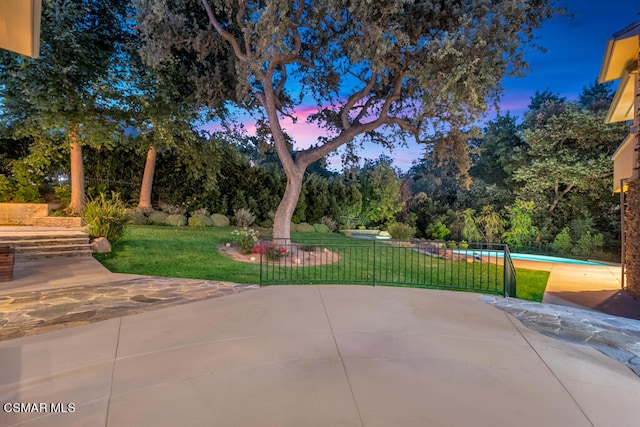 patio terrace at dusk with a yard