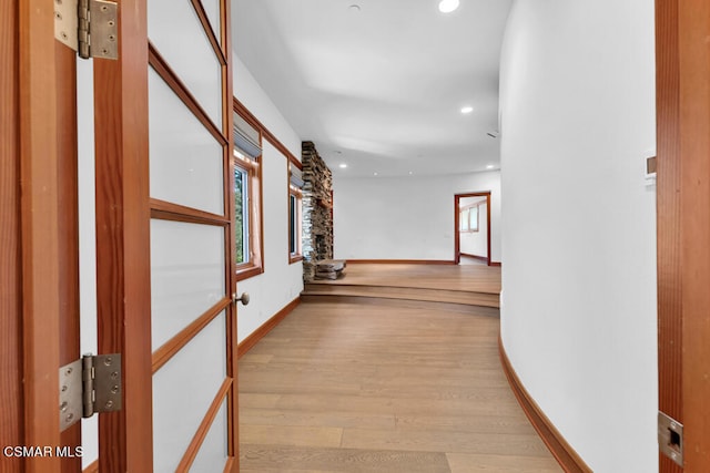 corridor with light wood-type flooring