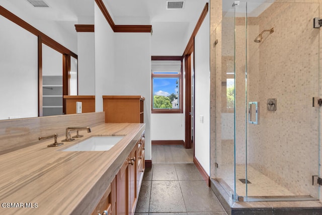 bathroom with a shower with door and vanity