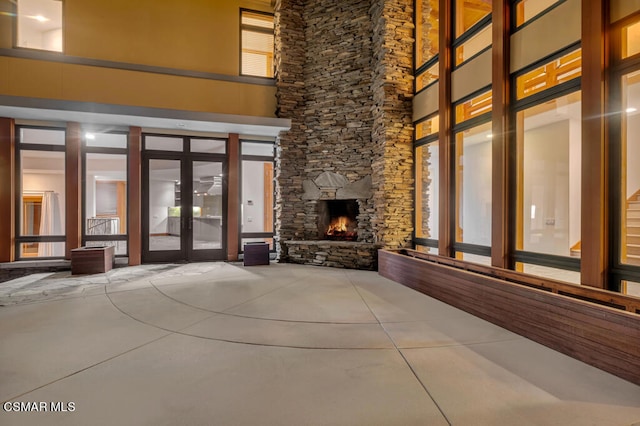 interior space featuring french doors and a fireplace